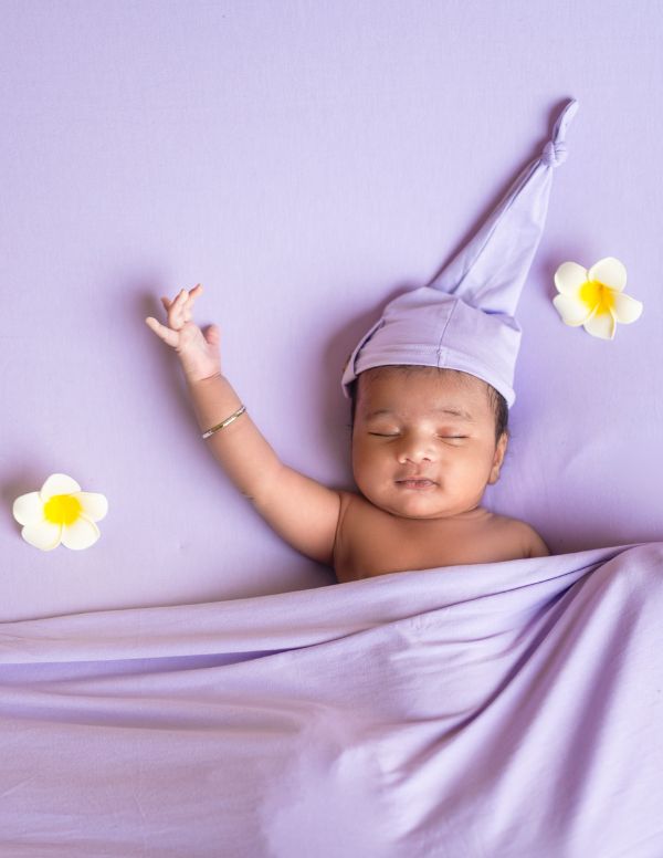 Smiling baby captured during a cute themed baby photoshoot session in Kolkata by our photographer
