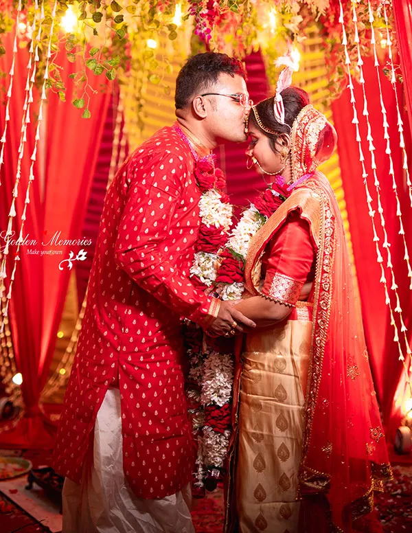 Bride and groom posing during a traditional wedding shoot in Kolkata by a professional photographer
